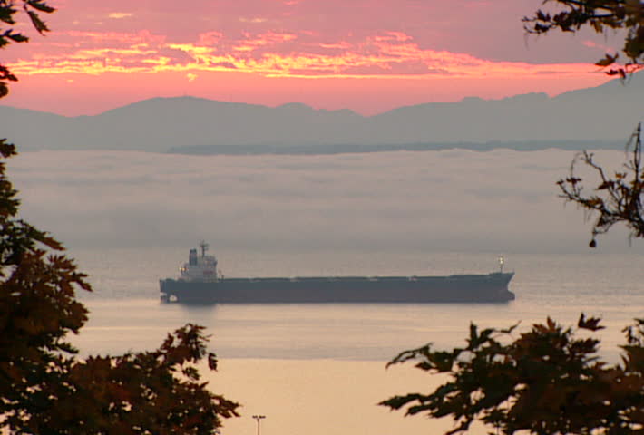 SEATTLE - Circa 2002: Barge sits in bay with rolling fog in 2002.