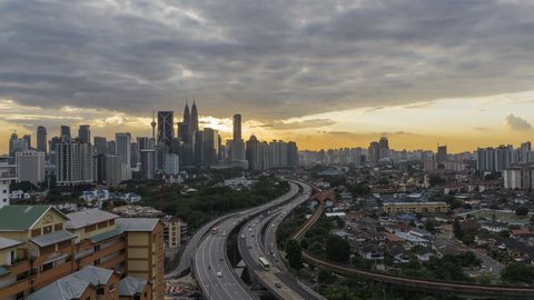 Sunset Time lapse with busy light trail traffic on a freeway of Kuala Lumpur, Malaysia