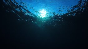 Underwater ocean footage. Sun on sea surface