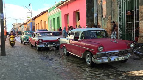 CUBA, - NOVEMBER 06:
Hard road traffic with old American cars on the narrow Trinidad cobbled street.
November 06, 2016 in Trinidad, Sancti Spiritus, Cuba