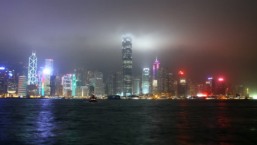 Skyscrapers in Hong Kong city at night from Victoria harbour view