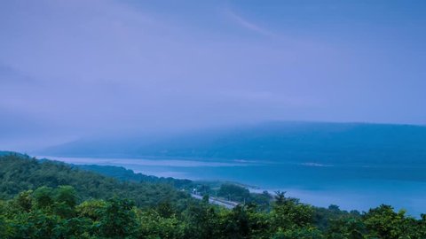 Awesome dynamic time lapse of fog drifting over the mountain lake at Lam Ta Khong Reservoir, Nakhon Ratchasima province, Thailand.