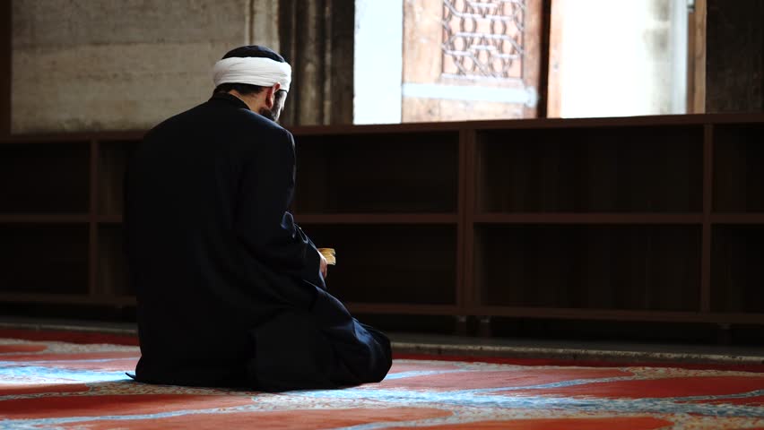 Muslim man reading Koran or Quran | Shutterstock HD Video #24744029