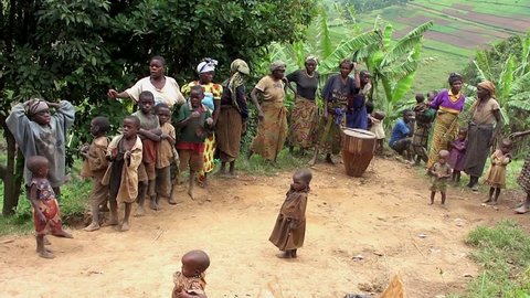 LAKE BUNYONYI, UGANDA - OCTOBER 21: Batwa pygmies dancing on October 21, 2012 at Lake Bunyonyi, Uganda. Pygmy people are ancient dwellers in the forests, known as The Keepers of the Forest.
