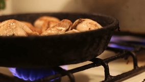 Home Preparing Of Chicken In Frying Pan,Chicken thighs, wings, fillet roast in a frying pan in the kitchen close up view