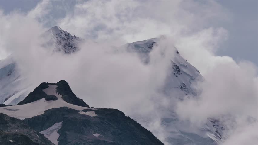 Early morning views of the Mount Cook, Aoraki, region of the South Island of New Zealand, including the surrounding mountains on a cloudy and overcast day. 