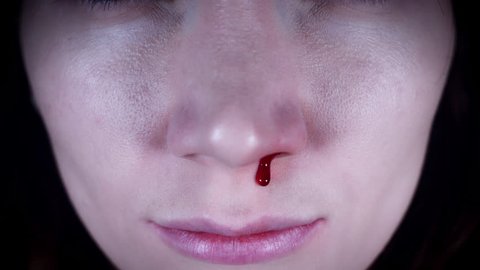 4K Horror Close-Up of Woman Nose Bleeding