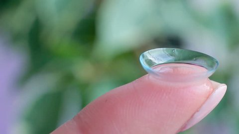 Macro filming a contact lens on a finger