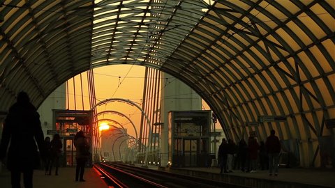 Bucharest, Romania - January 12, 2017: Basarab Overpass, modern tram station, with steel and glass structure, at sunset.