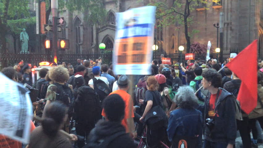 NEW YORK - MAY 1, 2012: Occupy Wall Street Protestors march down Broadway as police and protestors confront each other