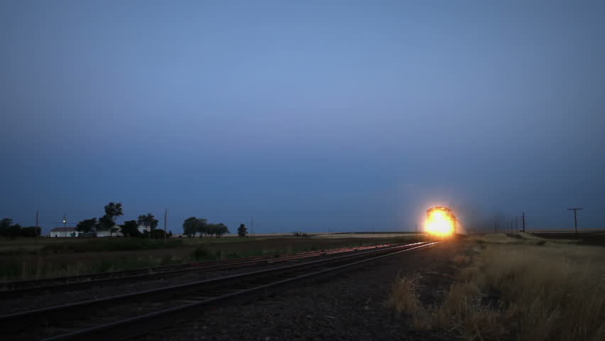 Very fast moving train at dawn in rural Colorado. HD 1080p.