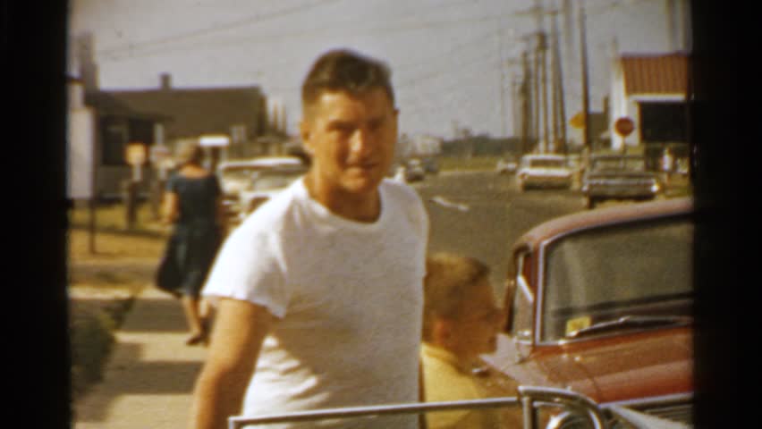 SAN FRANCISCO 1959: man closes car door for wife then walks around car talking to camera. | Shutterstock HD Video #24783692