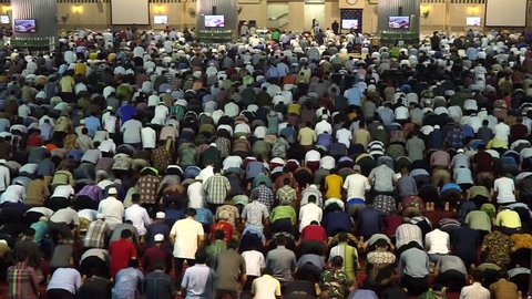 JAKARTA, JANUARY 30, 2017: Back view of religious muslim men doing the Friday prayer time together in the mosque