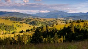 Magical view the green hills that glowing in sunlight. Picturesque and gorgeous morning scene. Location place Carpathian, Ukraine, Europe. Beauty world. Time lapse clip, interval shooting video.