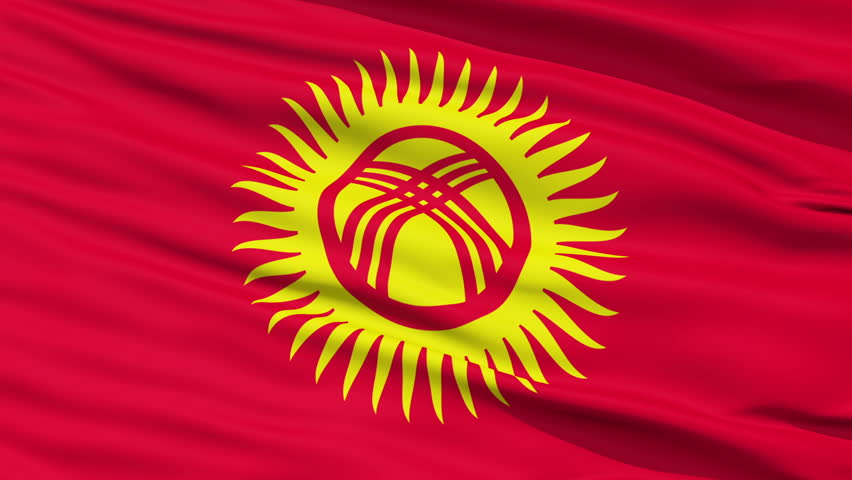 Closeup cropped view of a fluttering national flag of Kyrgyzstan