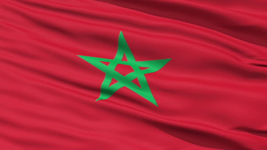 Closeup cropped view of a fluttering national flag of Morocco