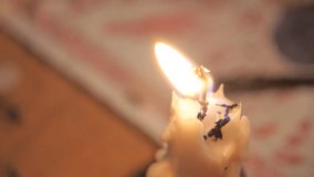 VIRGINIA - OCTOBER 2016 - Reenactment, American Revolutionary War 18th century era recreation -- Close Up of dripping candle on Tabletop of Tavern - smoking pipe by candle light & fireplace light. - Powered by Shutterstock - Get 15% off with code: PIKWIZARD15