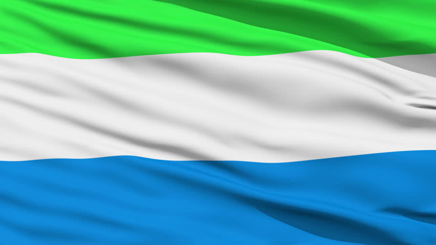 Closeup cropped view of a fluttering national flag of Sierra Leone