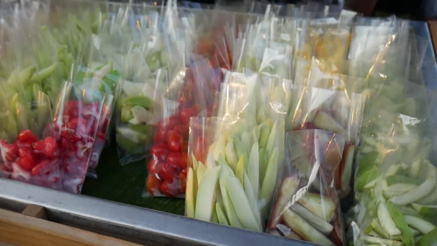 Vendor Selling Fresh Exotic Fruits at Local Thai Market. Phuket, Thailand.