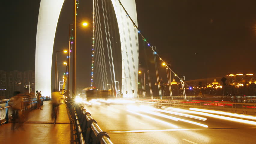 GUANGZHOU - MAY 12: Time lapse of Guangzhou Liede Bridge traffic at night on May
