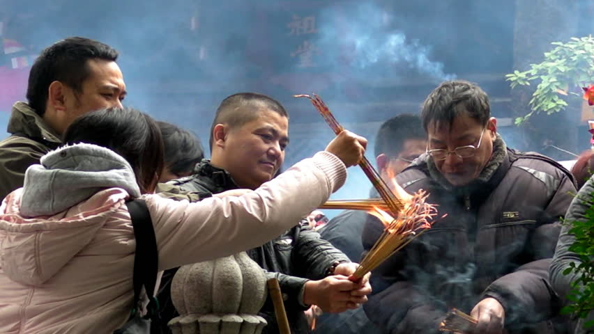 GUANGZHOU, CHINA - January 23: People burn incense in temple during Chinese New