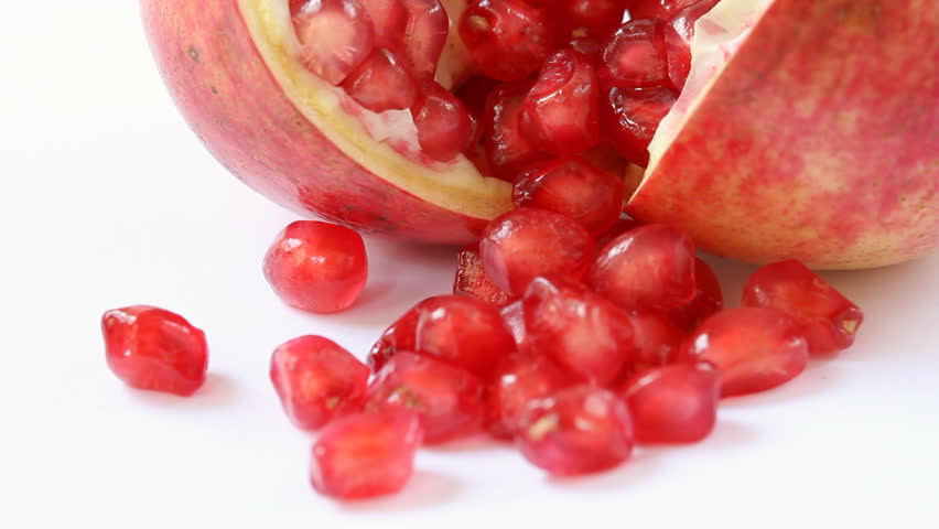 Ripe open pomegranate - Slow tilt up revealing the Ripe open pomegranate on