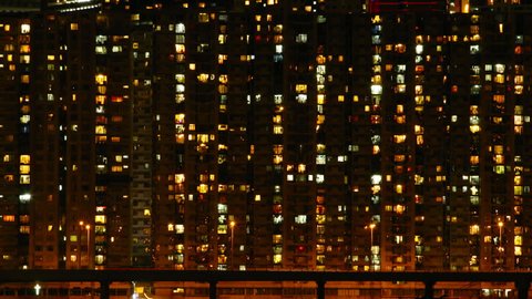 Time lapse of High-density apartment block at night, Hong Kong.