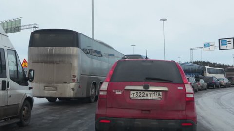 NUIJAMAA, FINLAND - CIRCA FEB, 2017: Many vehicles stand in long queue for custom and border control at winter season. Nuijamaa is the busiest border crossing point between Finland and Russia