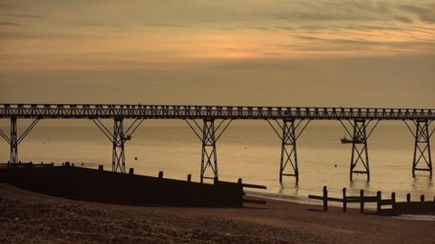Panned footage of Selsey lifeboat station/slipway situated on the shingle beach at Selsey west sussex UK footage shot at dawn. ( lifeboat station has since been demolished )