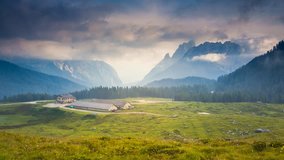 Fantastic misty view on the peak Cresta di Enghe. Dramatic and picturesque scene. Location place Sauris di Sotto, Dolomiti Alps. Italy, Europe. Beauty world. Time lapse clip, interval shooting video.