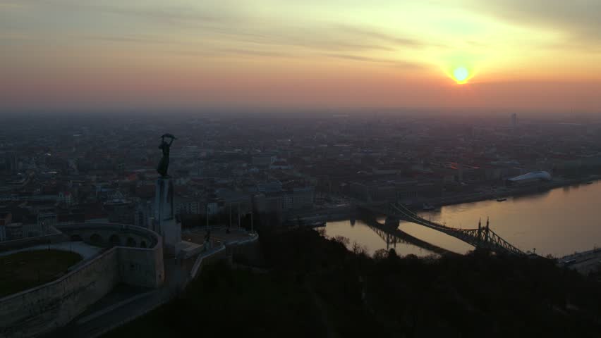 Aerial view of the Citadella and the Freedom Statue overlooking Budapest in sunrise
