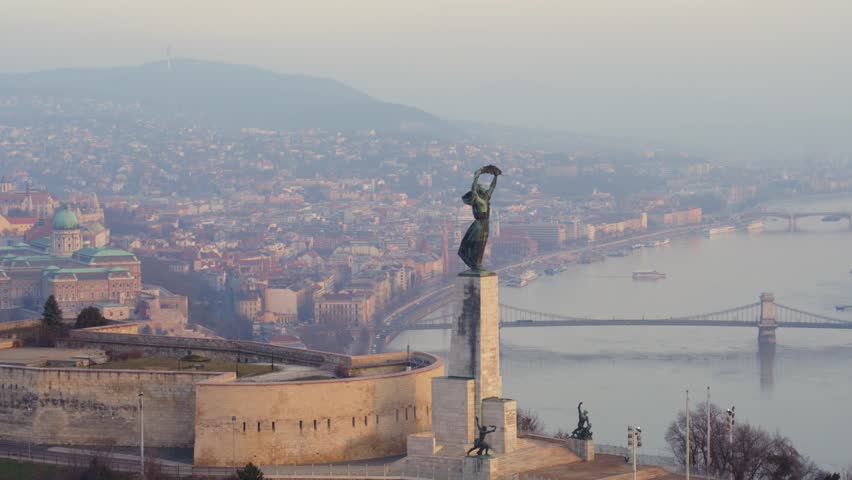 Aerial view of the Citadella and the Freedom Statue overlooking Budapest in sunrise