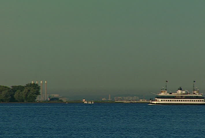 TORONTO - Circa 2002: The Toronto Island Ferry boats through Lake Ontario in 2002.