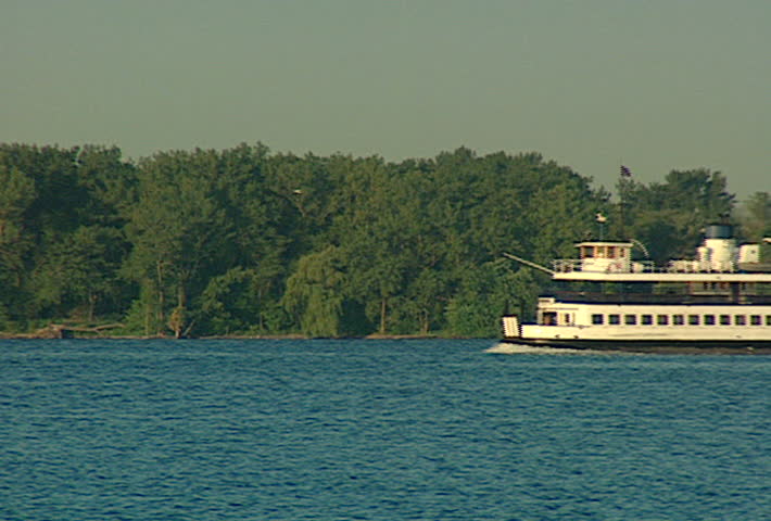 TORONTO - Circa 2002: The Toronto Island Ferry boats through Lake Ontario in 2002.