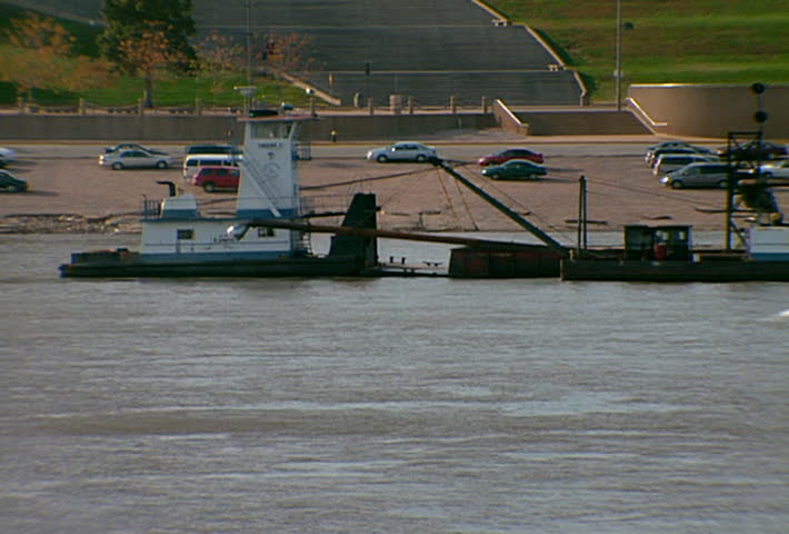 ST LOUIS - Circa 2002: Gateway Arch in the Skyline of St. Louis with boats in the Mississippi River in 2002.