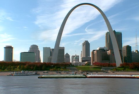 ST LOUIS - Circa 2002: Gateway Arch in the Skyline of St. Louis with boats in the Mississippi River in 2002.