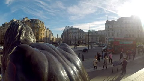 TRAFALGAR SQUARE, LONDON - MARCH 6, 2017. Amazing footage filmed in 4K using a large jib giving unusual and unique views of Trafalgar Square and the crowds, lions, statues and red buses. Clip 76