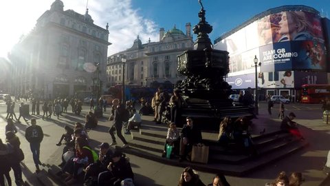 PICCADILLY CIRCUS, LONDON - MARCH 9, 2017. Amazing footage filmed in 4K using a large jib giving unusual and unique views of Piccadilly Circus, the Statue of Eros, the crowds and buses,  Clip 09