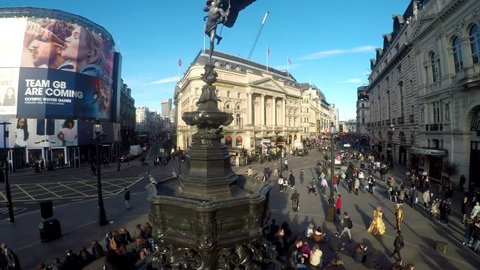 PICCADILLY CIRCUS, LONDON - MARCH 9, 2017. Amazing footage filmed in 4K using a large jib giving unusual and unique views of Piccadilly Circus, the Statue of Eros, the crowds and buses,  Clip  06