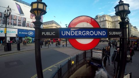 PICCADILLY CIRCUS, LONDON - MARCH 9, 2017. Amazing footage filmed in 4K using a large jib giving unusual and unique views of Piccadilly Circus, the Underground station, the crowds and buses,  Clip 16