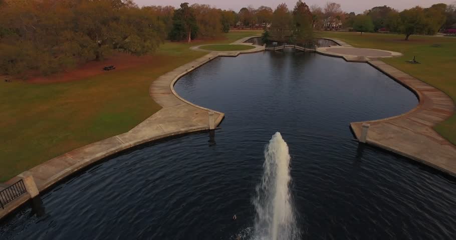 Elegant pond with fountain in a park in Charleston.