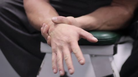 Man has carpel tunnel pain in hands after exercising wrists and forearm muscles 