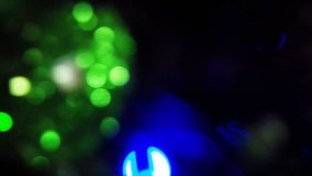 New Year's bokeh. Blur on a Christmas tree. Beautiful multicolored colors. Close-up.