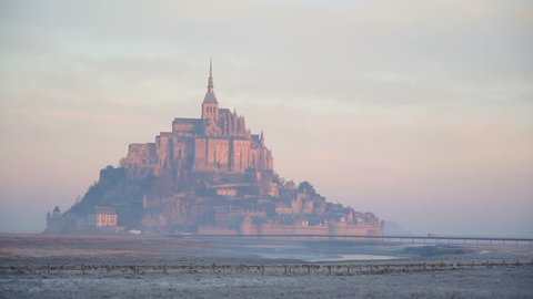 The majestic island of Mont-Saint-Michel in the dawn haze, Go Everywhere Video de stock