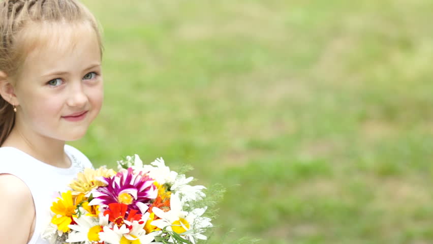 Portrait smiling girl with bouquet of flowers