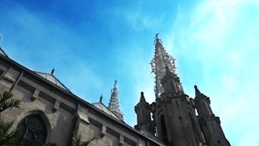 Video footage of a church tower with blue sky