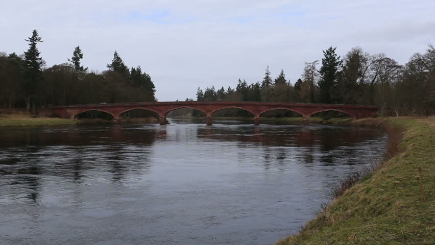 Traffic passing across bridge over River Tay near Meikleour, Scotland
