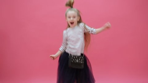 cute young girl jumping and clapping