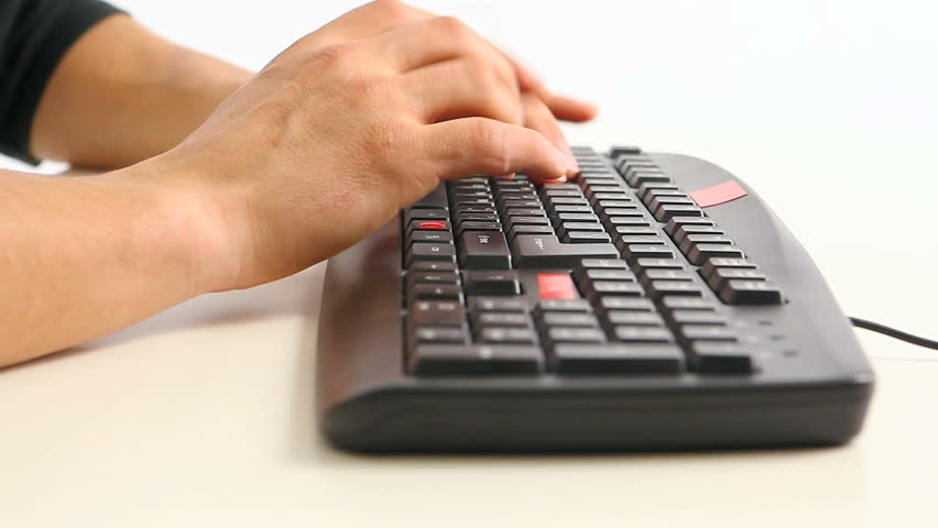 Guy typing something on keyboard