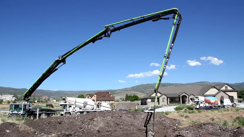 A cement pump truck pouring the footings of a house